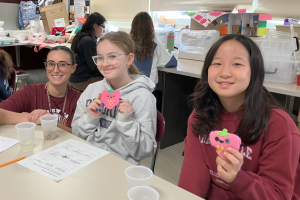  students posing with their monsters